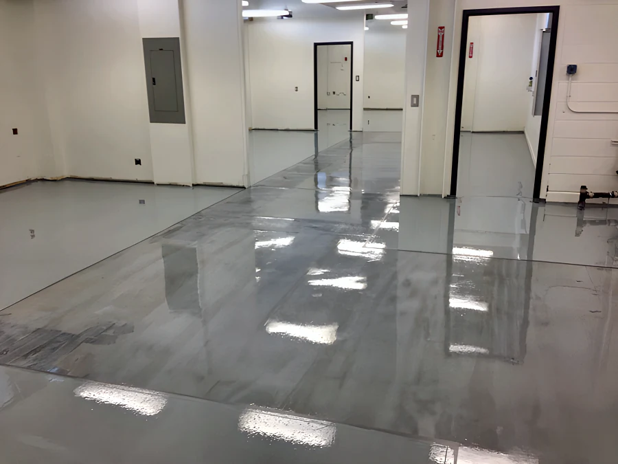 Grey ESD floor through the rooms and down the corridor of a BC Hydro facility, installed to protect electronics from static damage