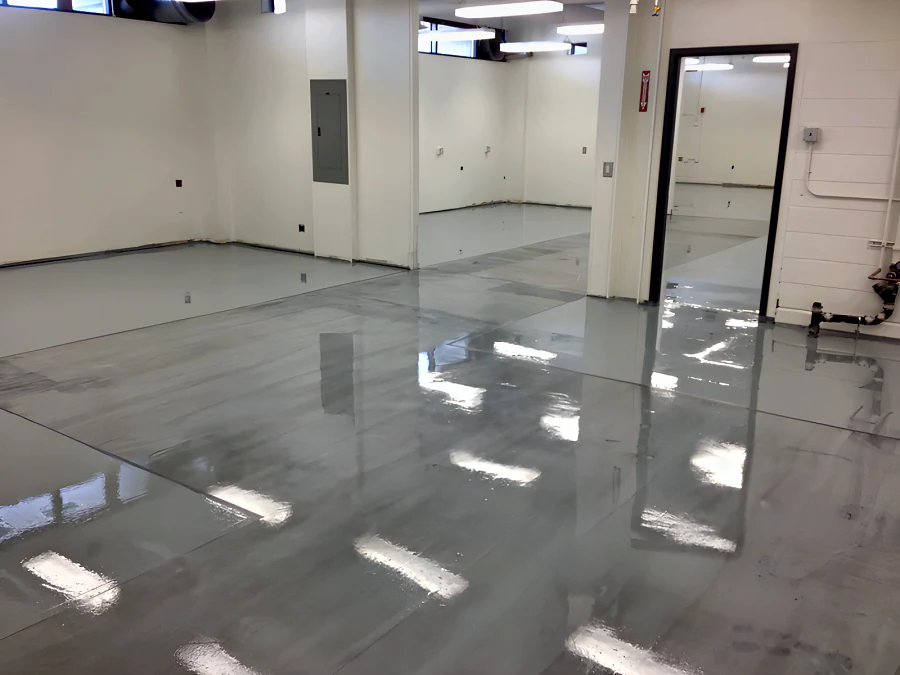 High-gloss grey ESD static control floor across the rooms of a BC Hydro facility, running through the doorways into the rooms beyond