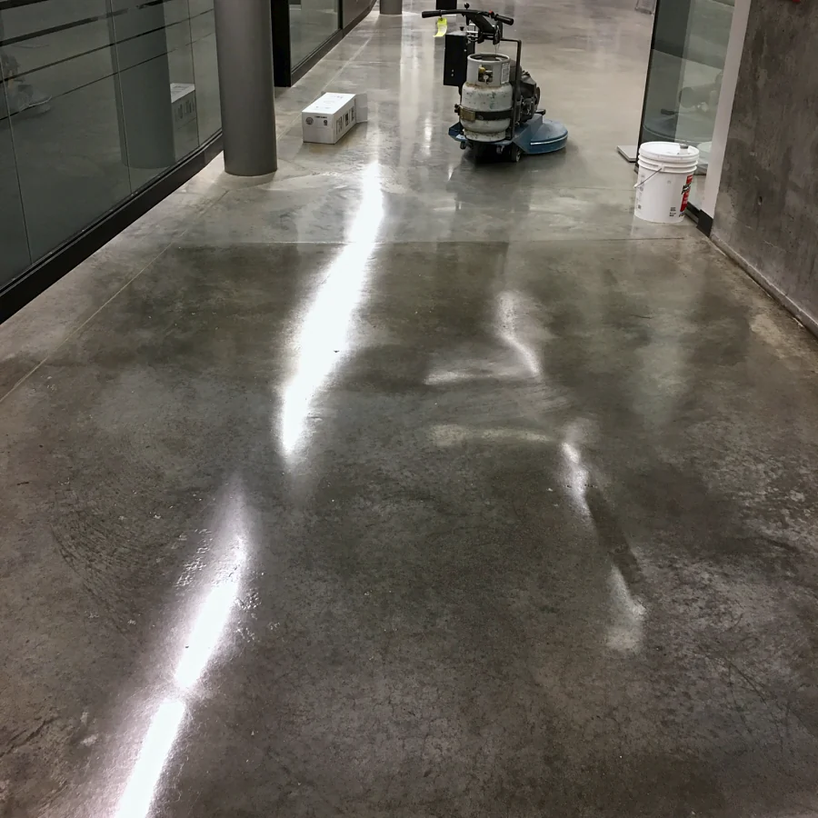A polished concrete corridor at the BCIT Aerospace Technology Campus in Richmond, the polishing machine at the far end