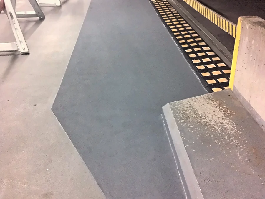 Traffic coating carried along the parapet edge and up the face of the curb in the Central City parkade, Surrey