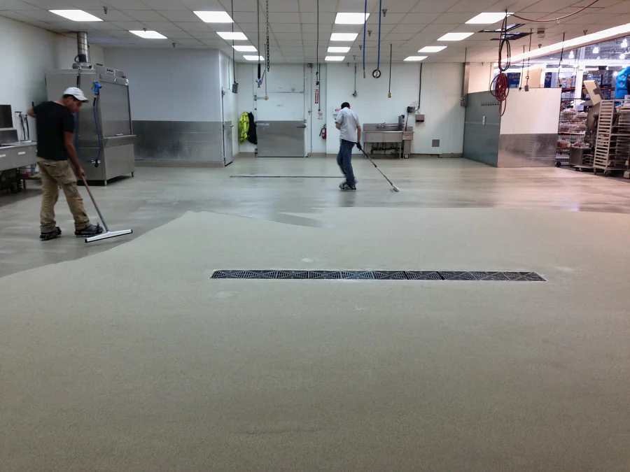 The next section of the Costco Abbotsford prep room floor going down past a trench drain