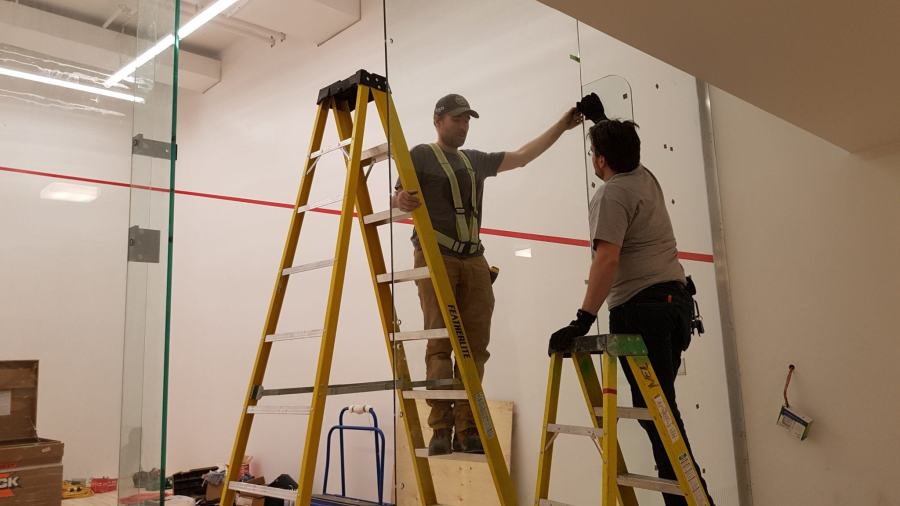 Two West Pacific crew members setting out a laser line on site