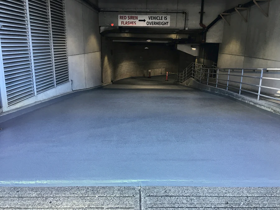 A textured traffic coating on the entrance ramp of a commercial building parkade in Downtown Vancouver, 2016