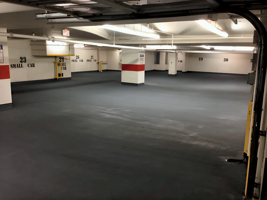 Finished dark grey Kelmar traffic coating with a textured surface across a parking level of the Hampton Inn & Suites, Downtown Vancouver