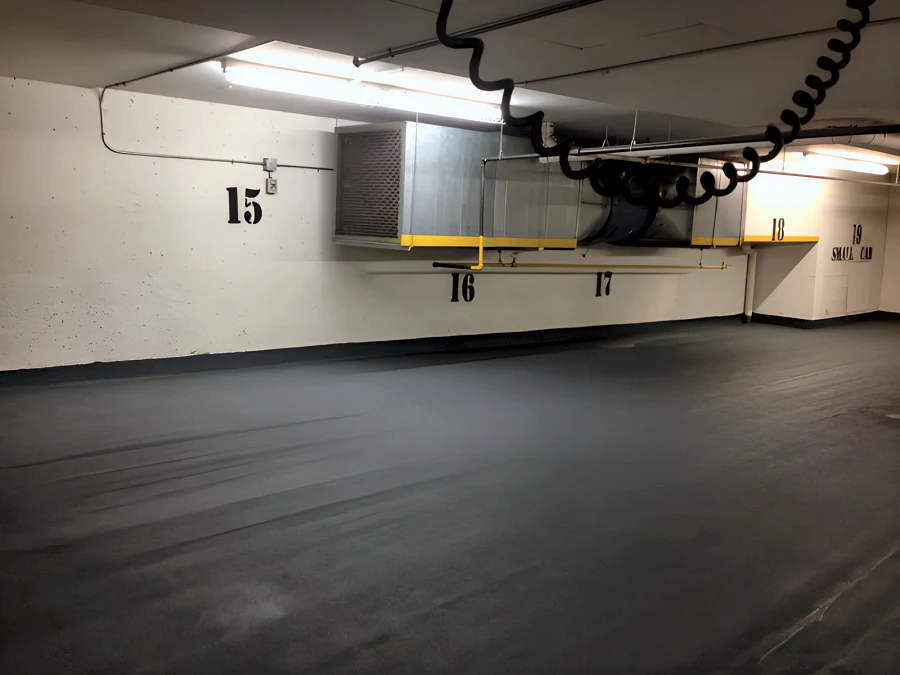 Kelmar traffic coating turned up the wall base beneath the stall numbers in the Hampton Inn & Suites parkade, Vancouver