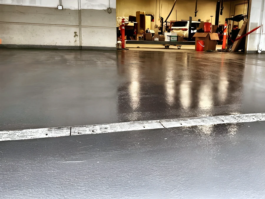 Glossy epoxy floor coating in a Hyundai dealership workshop