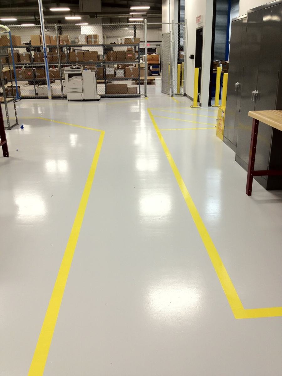 Shop floor with epoxy coating and yellow line marking