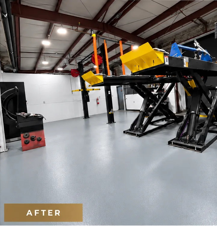 Mazda Richmond Automall service shop after coating: a continuous light grey resinous floor under the scissor hoist