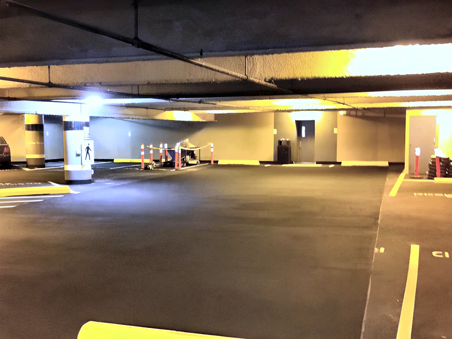 Kelmar T.E. parkade coating at Metrotown with fresh yellow stall and aisle lines
