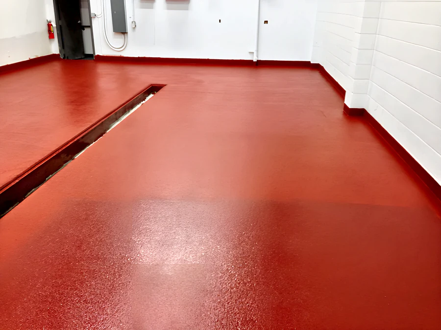 Red EWS floor turned up the block walls as a cove base, round the corners and along the trench drain, at Parallel 49 Brewing Company