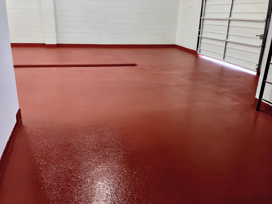Red EWS floor with a coved base running to the overhead door in a phase 2 room at Parallel 49 Brewing Company, Vancouver