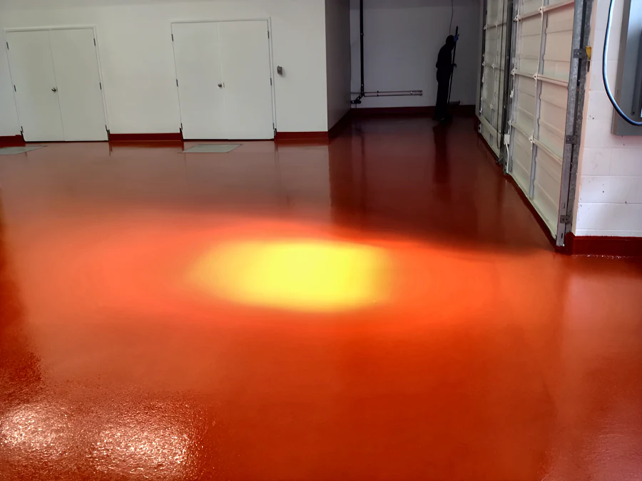 Red Eco Shop Floor finished to the roll-up doors at Parallel 49 Brewing Company, under a work lamp