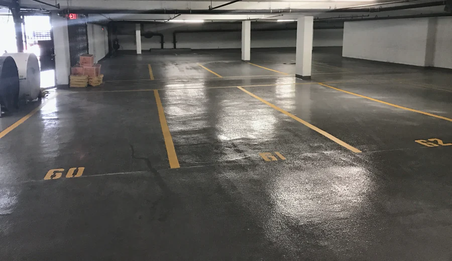 Stalls lined in yellow and numbered over the new coat, a drying fan and materials by the entrance, 2017