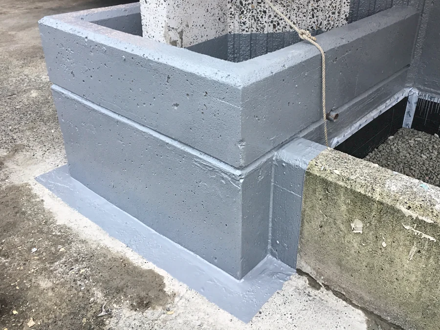 ResinTech FPU and PPM membrane turned up a column and carried out onto the slab at the corner of a planter
