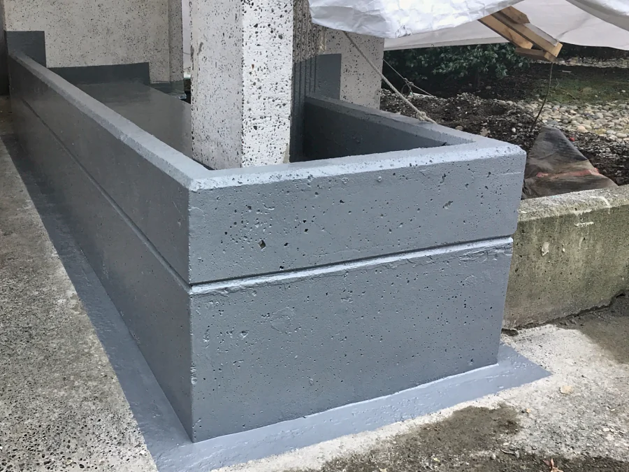The planter along the building, waterproofed in ResinTech FPU and PPM, the membrane carried onto the slab at the base