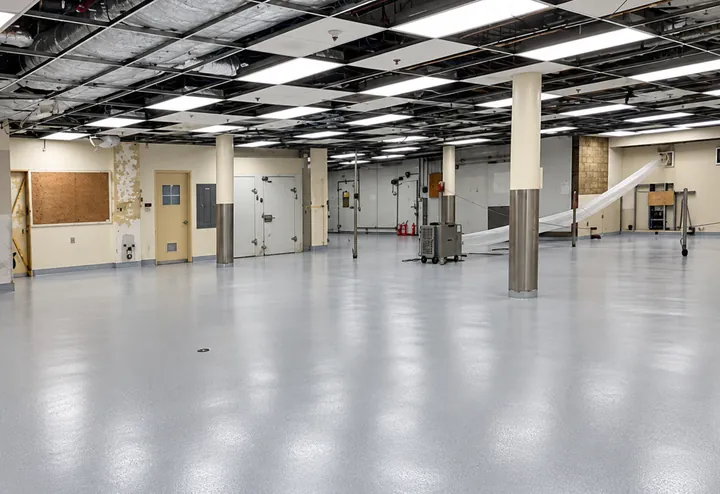 Grey flake broadcast floor with an integral coved base in a service area at Ridge Meadows Hospital