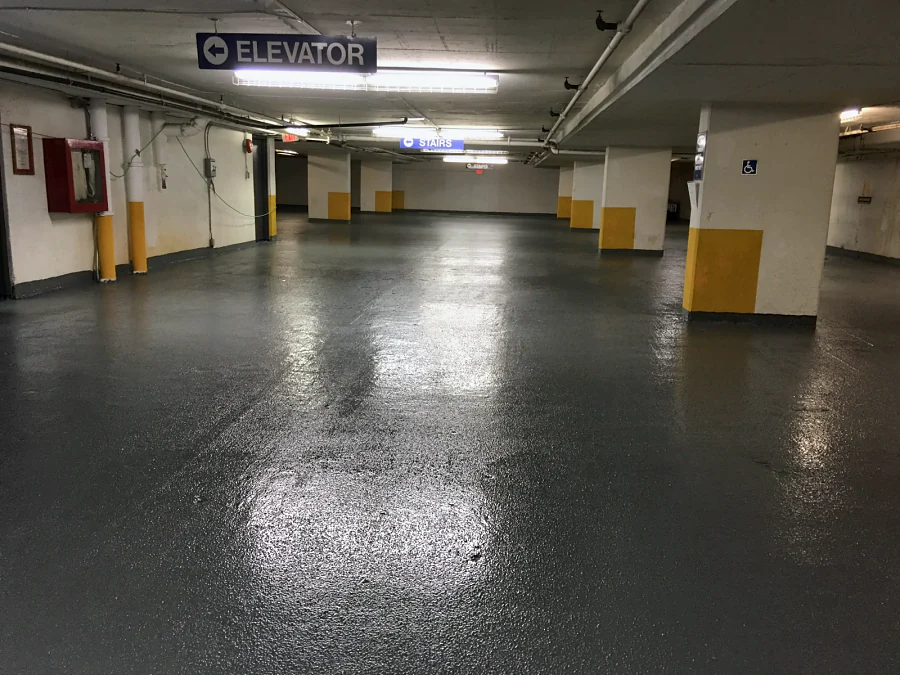 The finished grey traffic coating through the Sandman Hotel parkade in Downtown Vancouver, towards the elevator and stairs, 2017