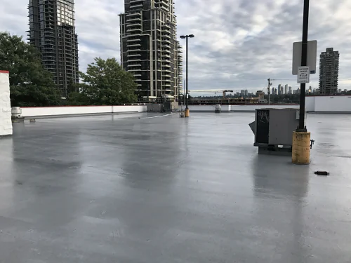 The rooftop deck of a Staples store in Burnaby, finished in a grey Tremco Vulkem traffic coating
