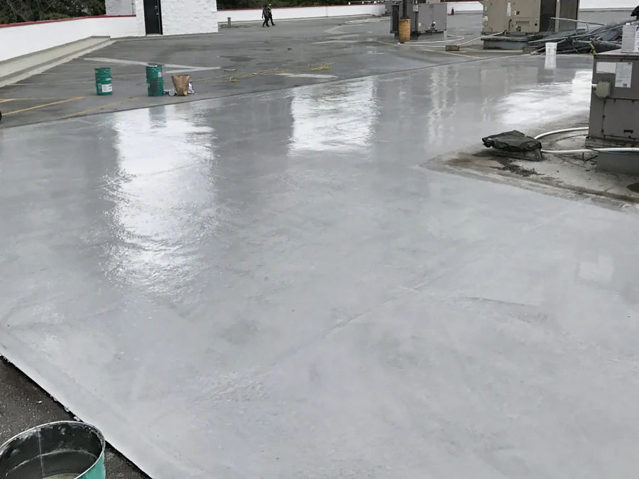 The fresh grey Tremco Vulkem 350NF/950NF/951NF coat by the rooftop units of a Staples store’s rooftop parkade in Burnaby, 2017