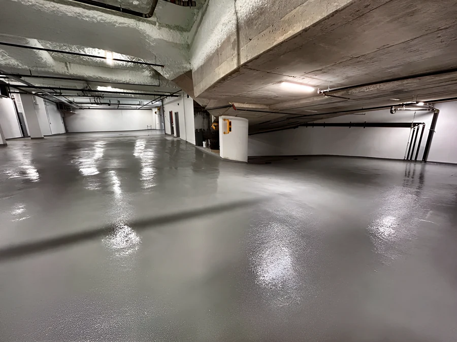 Glossy grey vehicular traffic coating in the parkade of a residential building
