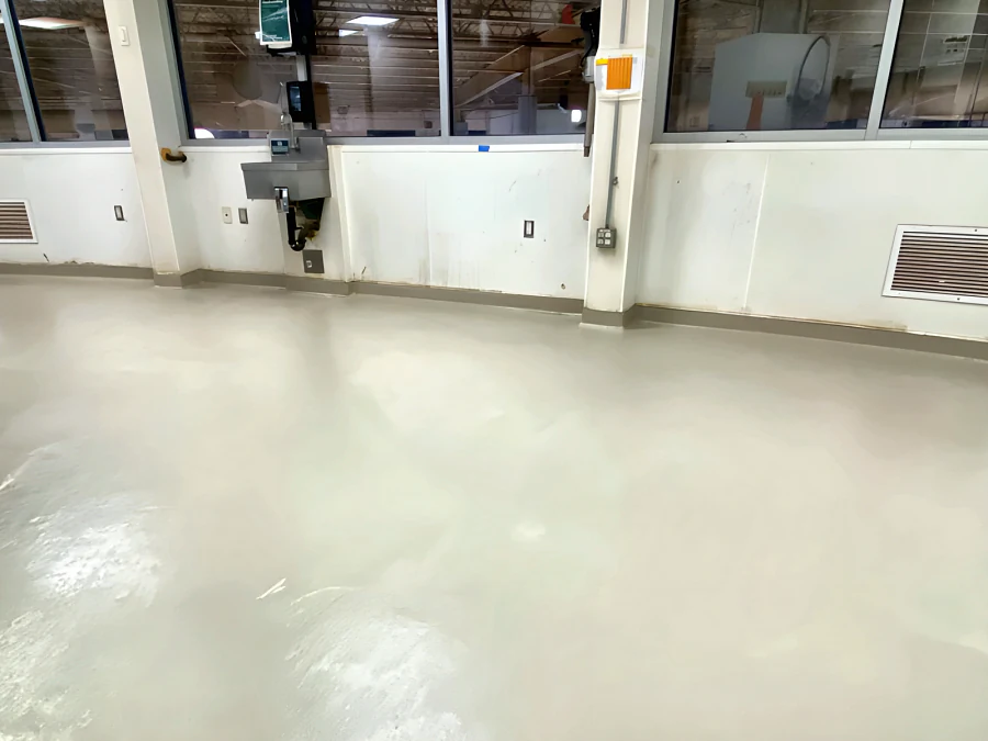 Light cementitious urethane floor in a Whole Foods room with windows along one wall