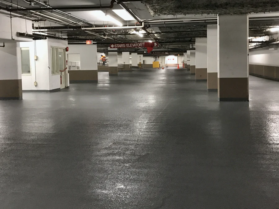 A wide view of the recoated parking level in the Whole Foods parkade in Vancouver, down the rows of columns