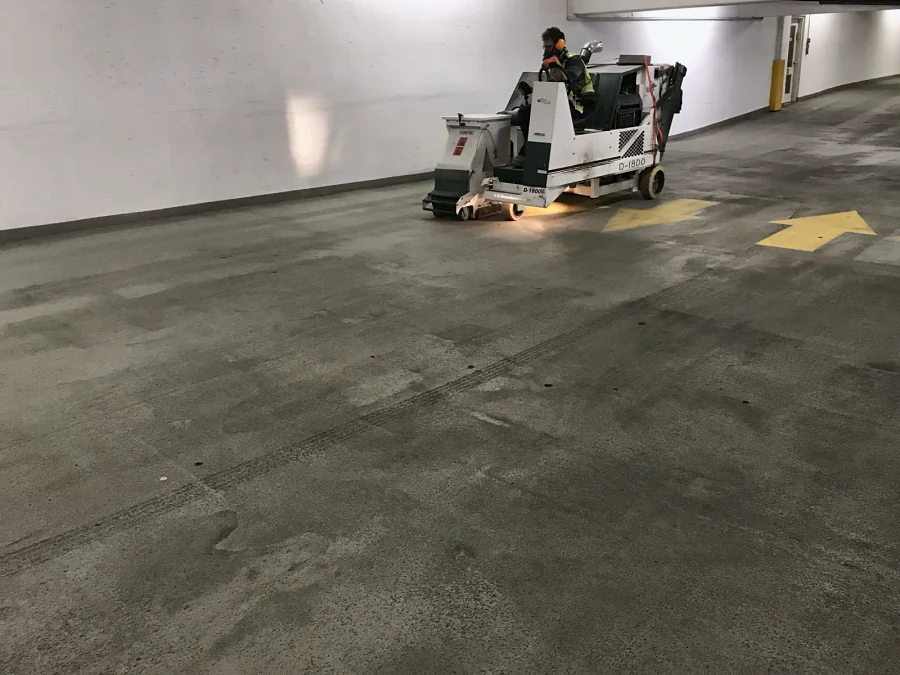 A ride-on shot blaster preparing the concrete deck of the Whole Foods parkade in Vancouver before the recoat